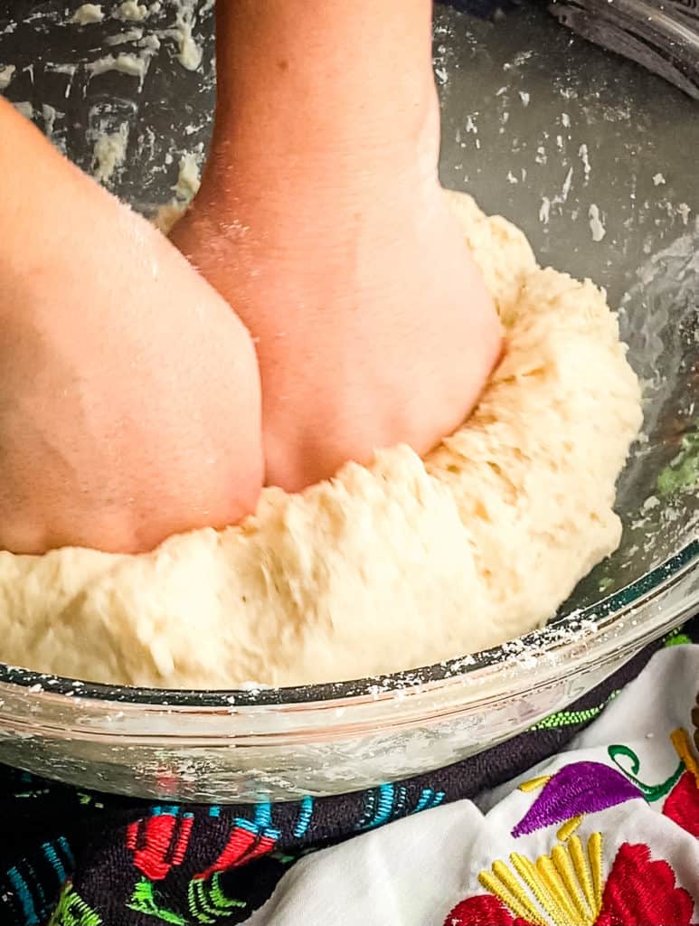 pressing the folded dough down into itself