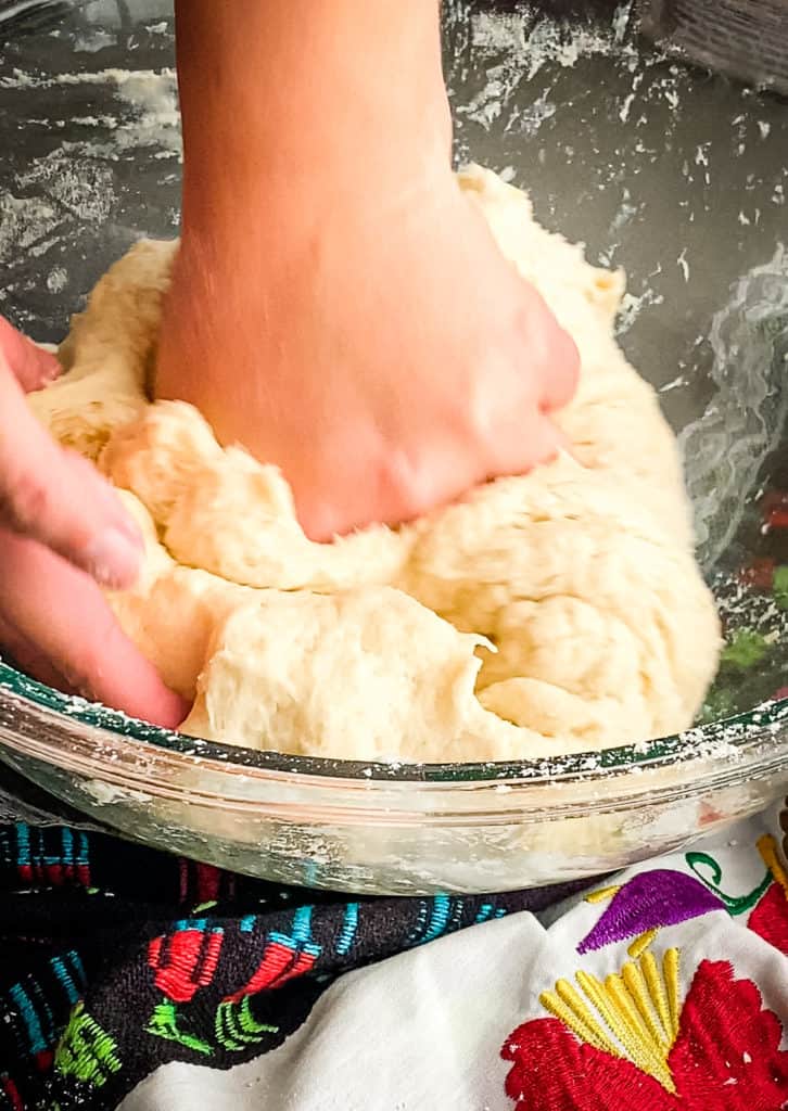 folding half of the dough on top of itself