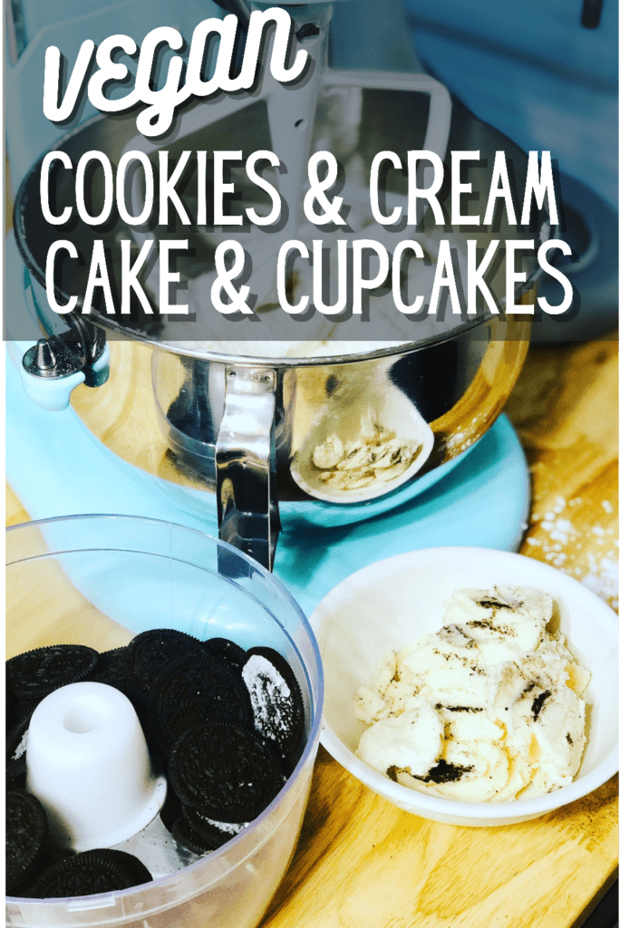 A food processor full of empty oreo cookies and a bowl full of the filling sitting in front of a light blue colored kitchenaid mixer on a butcherblock counter with text that reads vegan cookies and cream cake and cupcakes