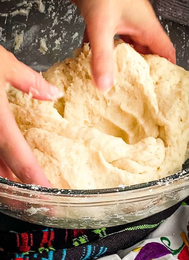 pressing the folded dough down into itself