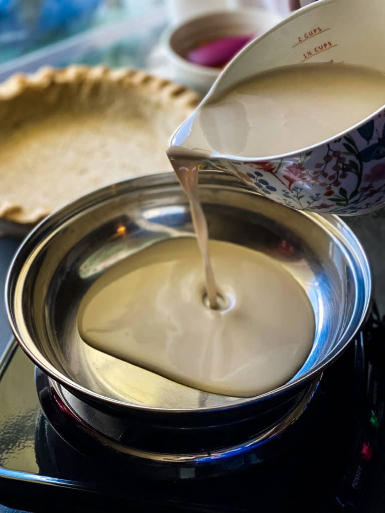 Adding the cold coffee creamer into the pan
