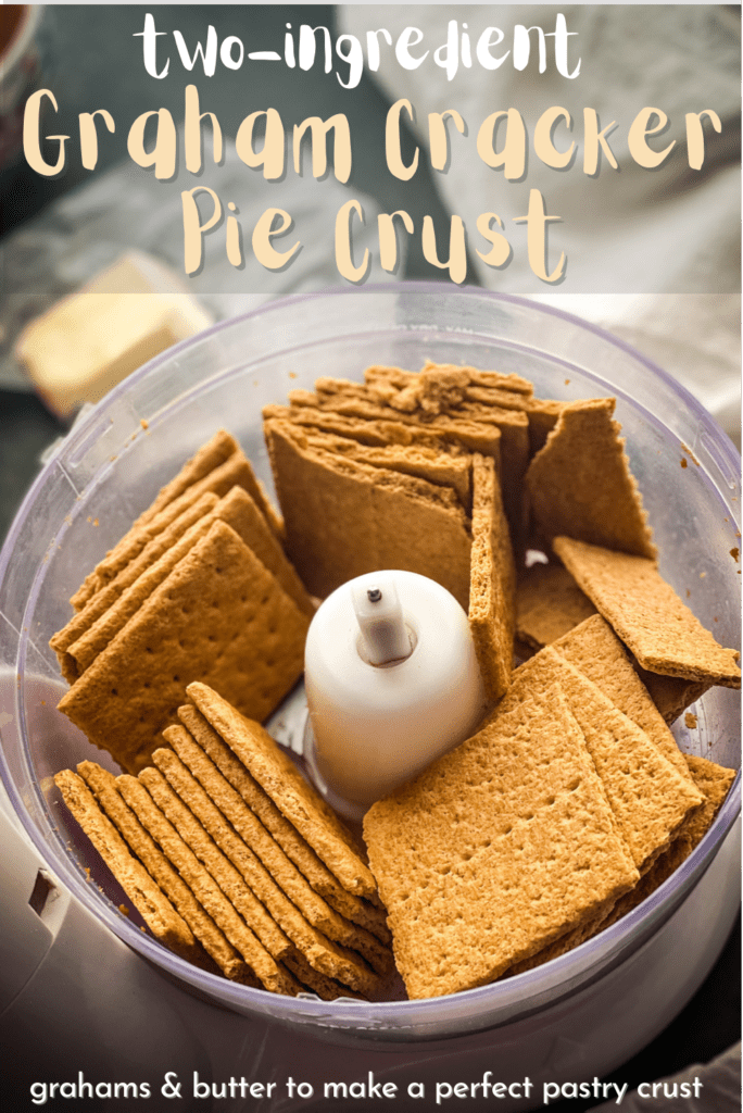 a food processor bowl filled with graham crackers and a half a stick of butter in the background. Text overlay reads "two ingredient graham cracker pie crust, grahams, butter to make a perfect pastry crust