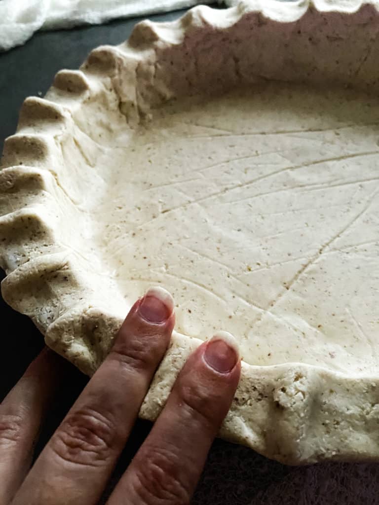 using my pointer and middle finger to create a faux crimped edge around the pie crust