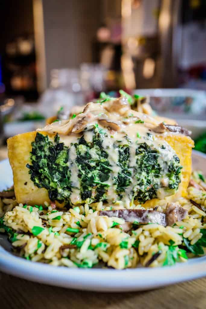 a golden fried tofu block stuffed with spinach, and loaded on top with shiitake mushroom marsala sauce. It's all sitting on a bed of garlic and herb wild rice.
