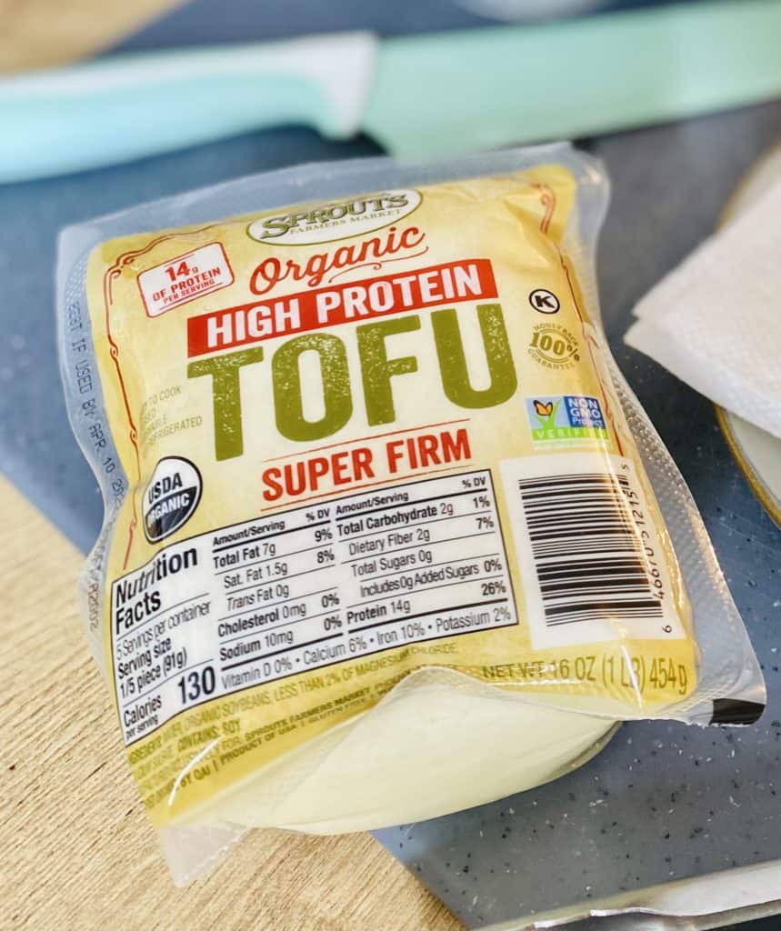 An unopened package of high-protein extra firm tofu from Sprouts.