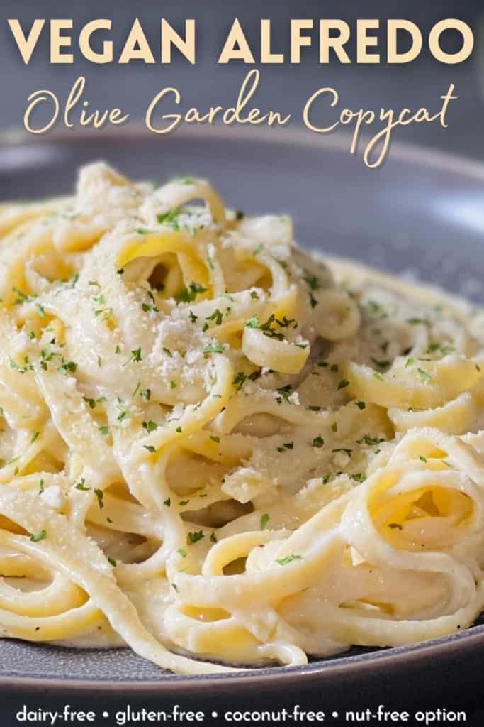 a pile of Alfredo on a grey plate with superimposed words that read "vegan Alfredo Olive Garden copycat dairy free gluten free coconut free nut free option"
