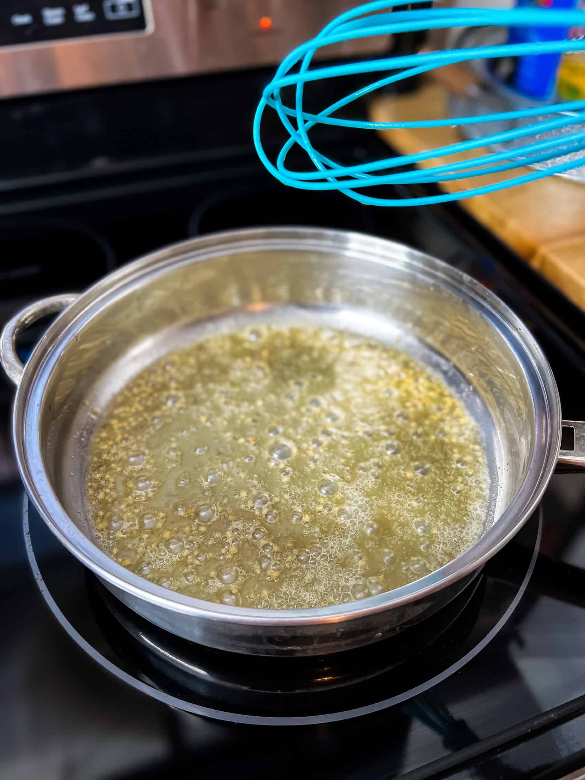 melted butter in a large stainless steel pan
